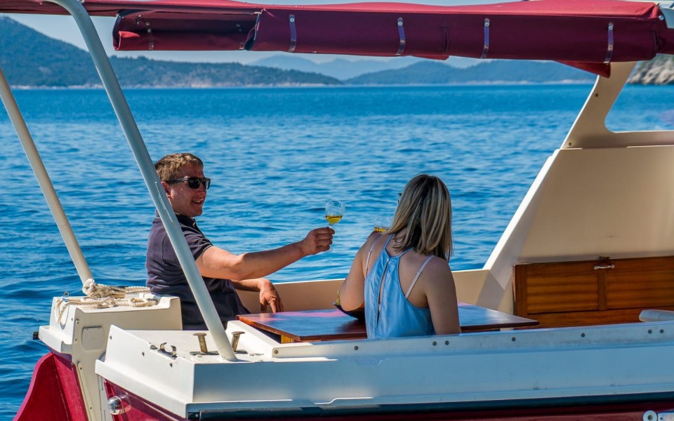Private boat rental couple enjoying a sea view