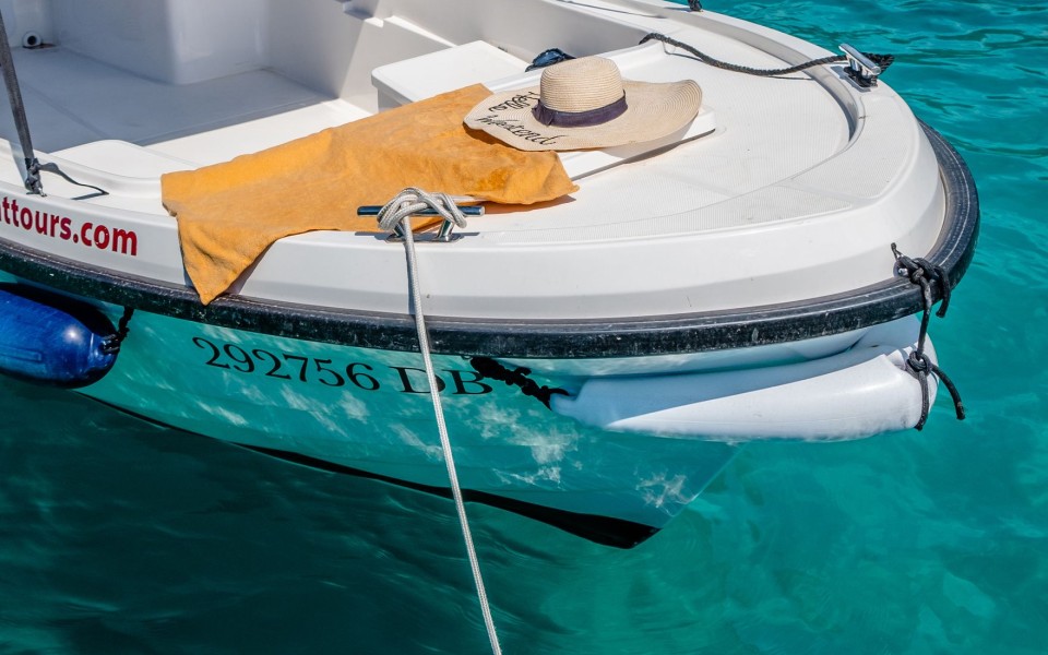 Boat tour essentials on a small boat in clear water