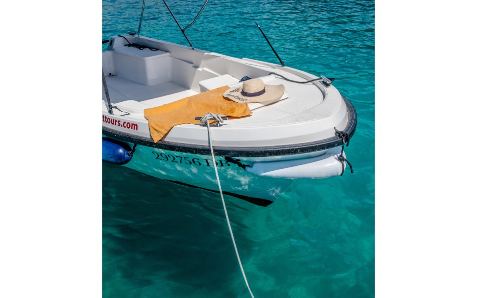 Private island excursion boat on turquoise coast